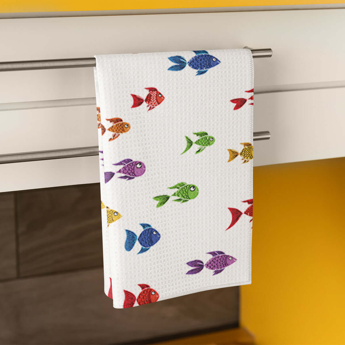 Vibrant Colorful Fish design dish towel hanging in a stylish kitchen.