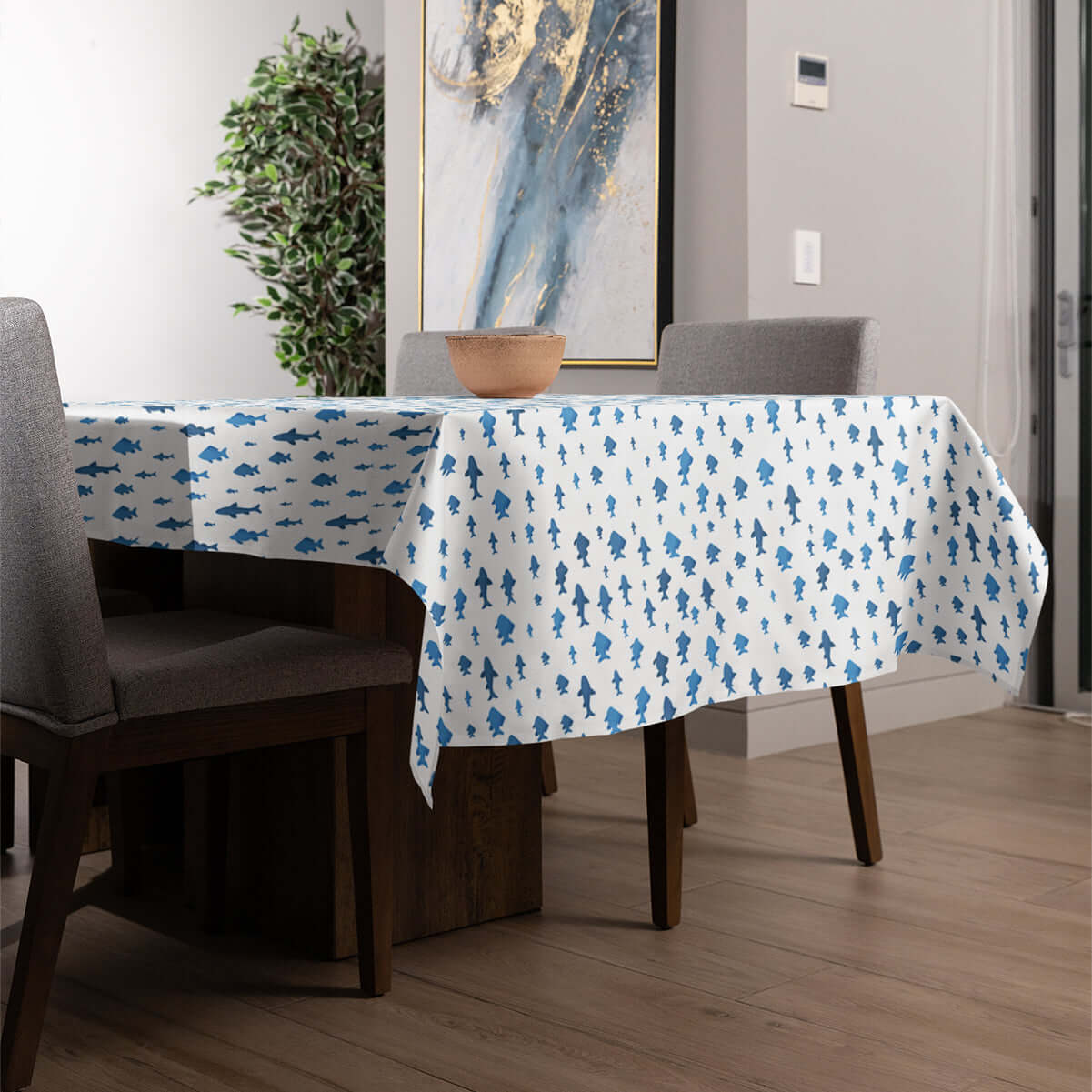 Fish and Shark design tablecloth on a dining room table.