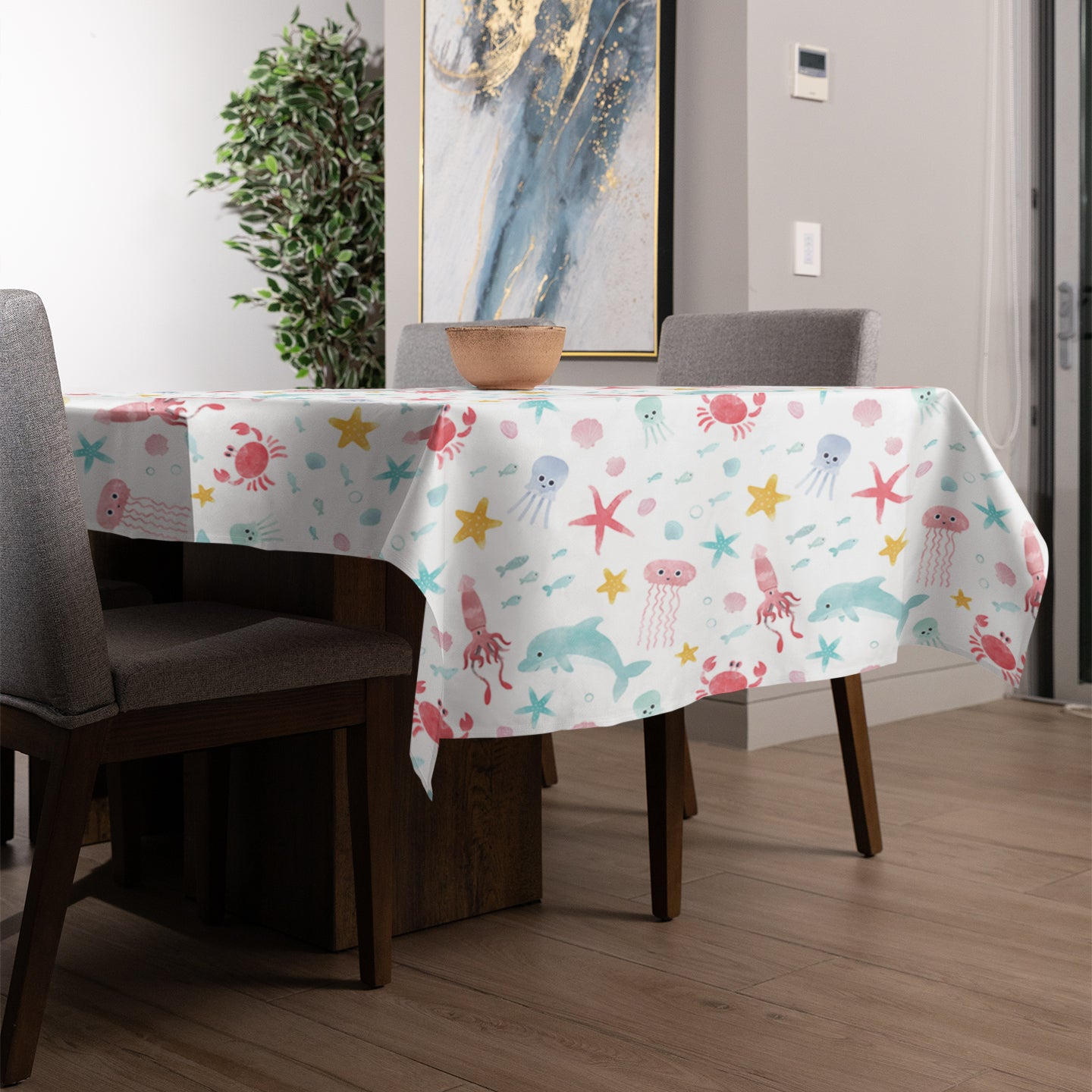 Fish and Jellyfish design table cloth on a dining room table.