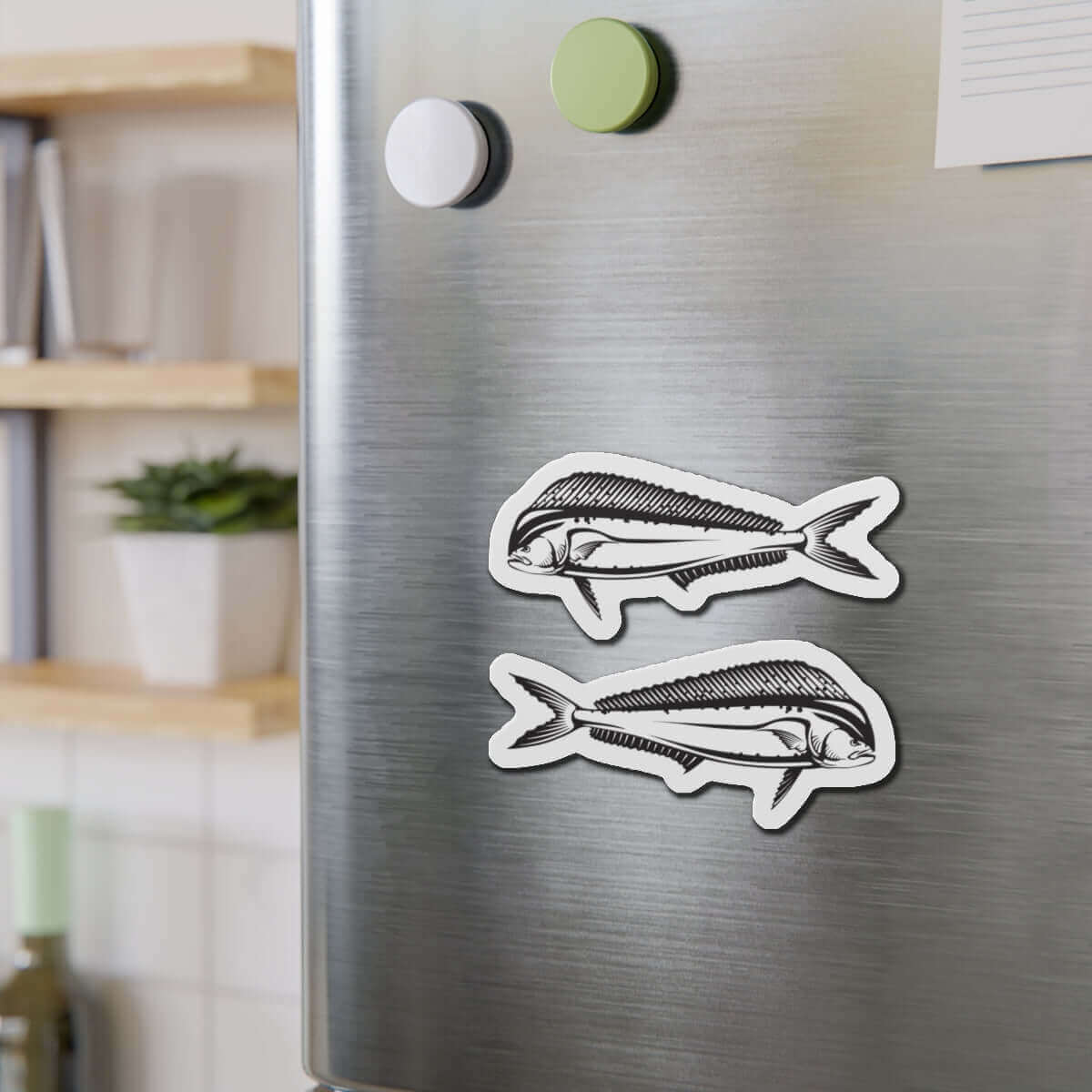 Mahi-Mahi fish shaped magnets on a fridge adding fun décor for fishing fans.