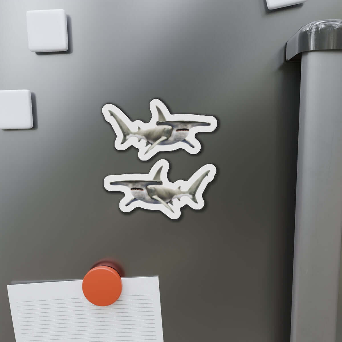 Hammerhead Shark fish shaped magnets on fridge, perfect for fish décor and fun kitchen flair.