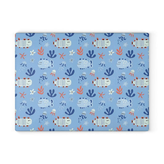 Cute fish decor glass cutting board with vibrant ocean-themed design on light blue background, perfect for kitchen and home accents.