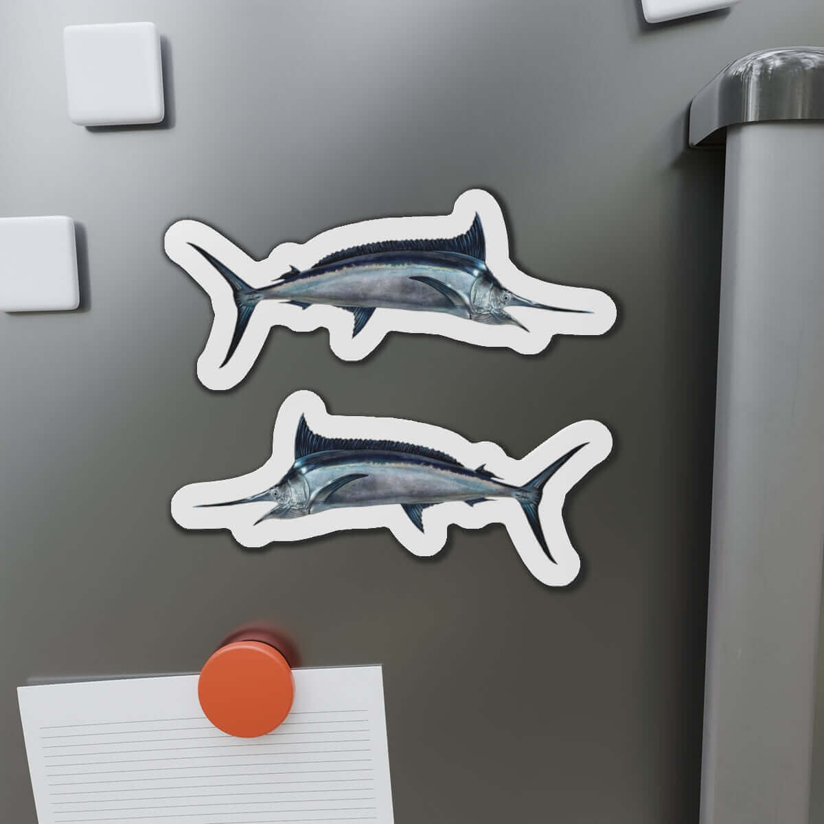 Black Marlin fish shaped magnets on refrigerator, perfect fish décor for fishing enthusiasts and fun fridge magnets lovers.