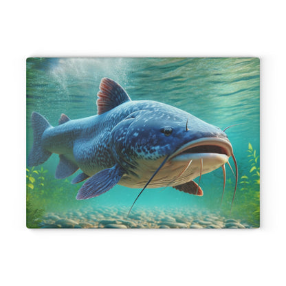 Vibrant catfish design on a glass cutting board in an underwater scene.