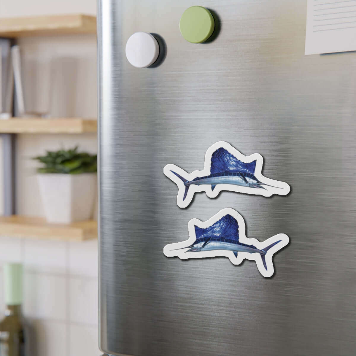 Sailfish shaped magnets on a fridge, perfect for fish décor and fun kitchen magnets.