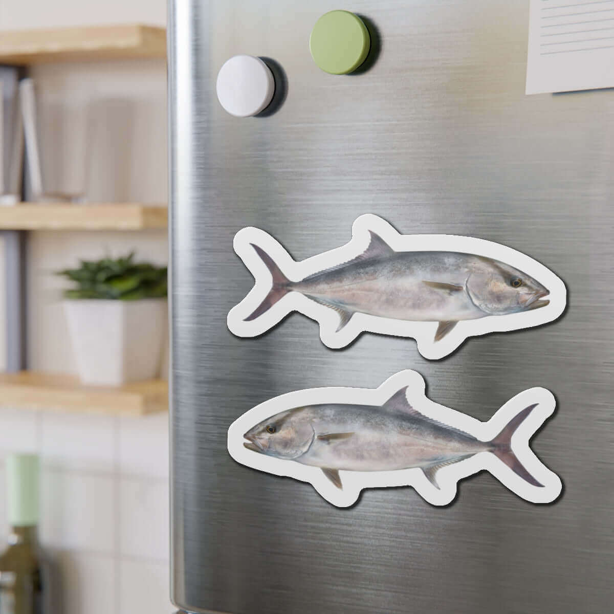 Amberjack fish shaped magnets on a refrigerator, perfect for fish décor and fun kitchen magnet enthusiasts.