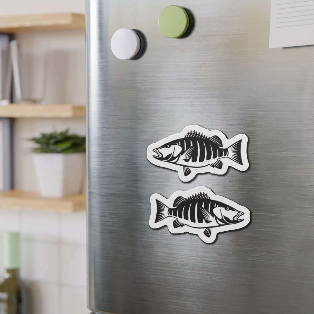 Snapper fish shaped magnets on a stainless steel fridge in a kitchen setting, perfect for fish décor and fun kitchen magnets.