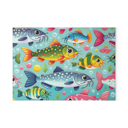 Colorful catfish illustration on a glass cutting board with vibrant fish design. Perfect for kitchen decor and food prep.