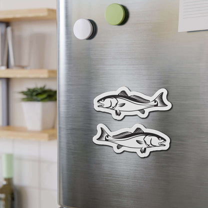 Red Drum fish shaped magnets on a refrigerator adding a fun kitchen décor touch.