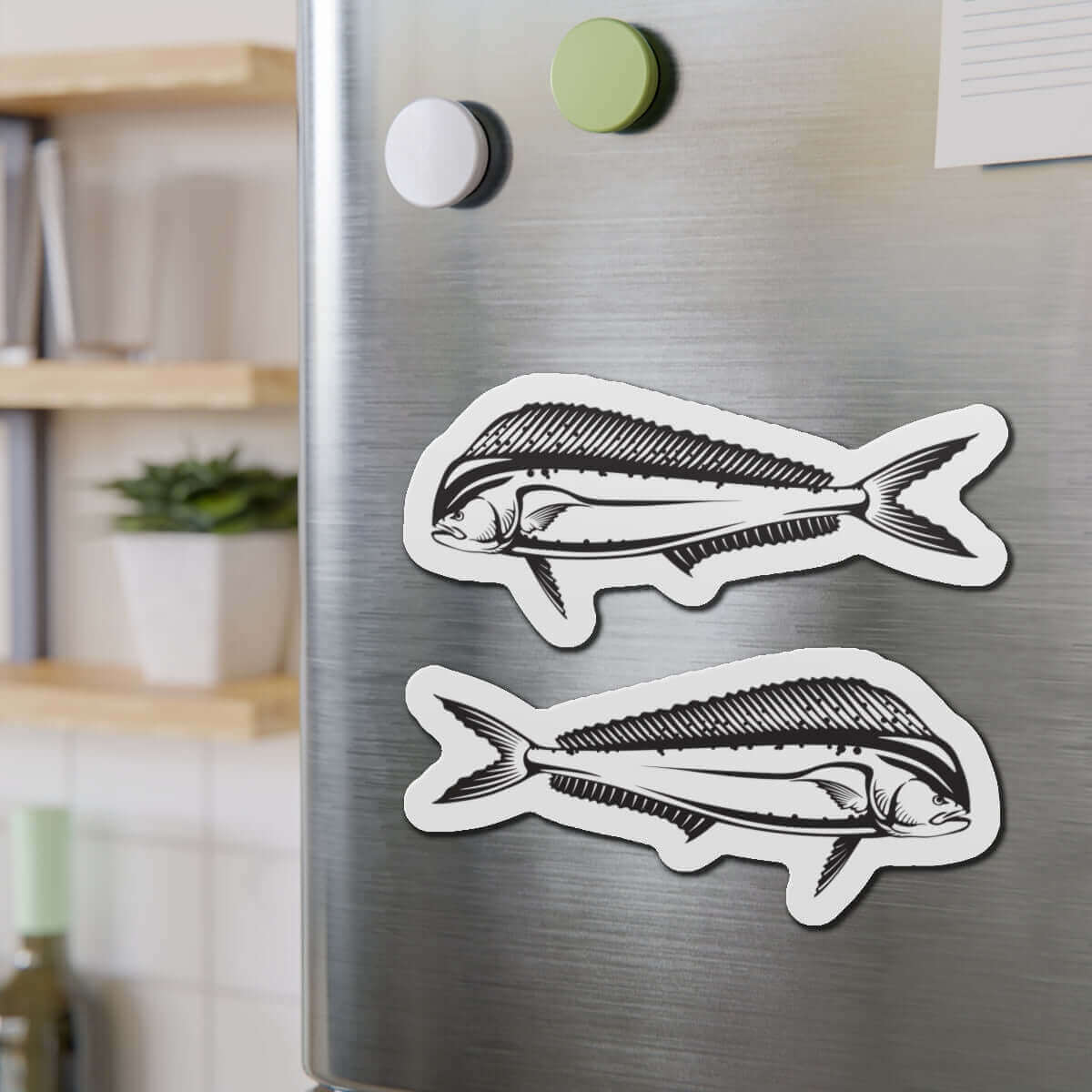 Mahi-Mahi fish shaped magnets on a fridge, perfect for fun kitchen décor and fishing enthusiasts.