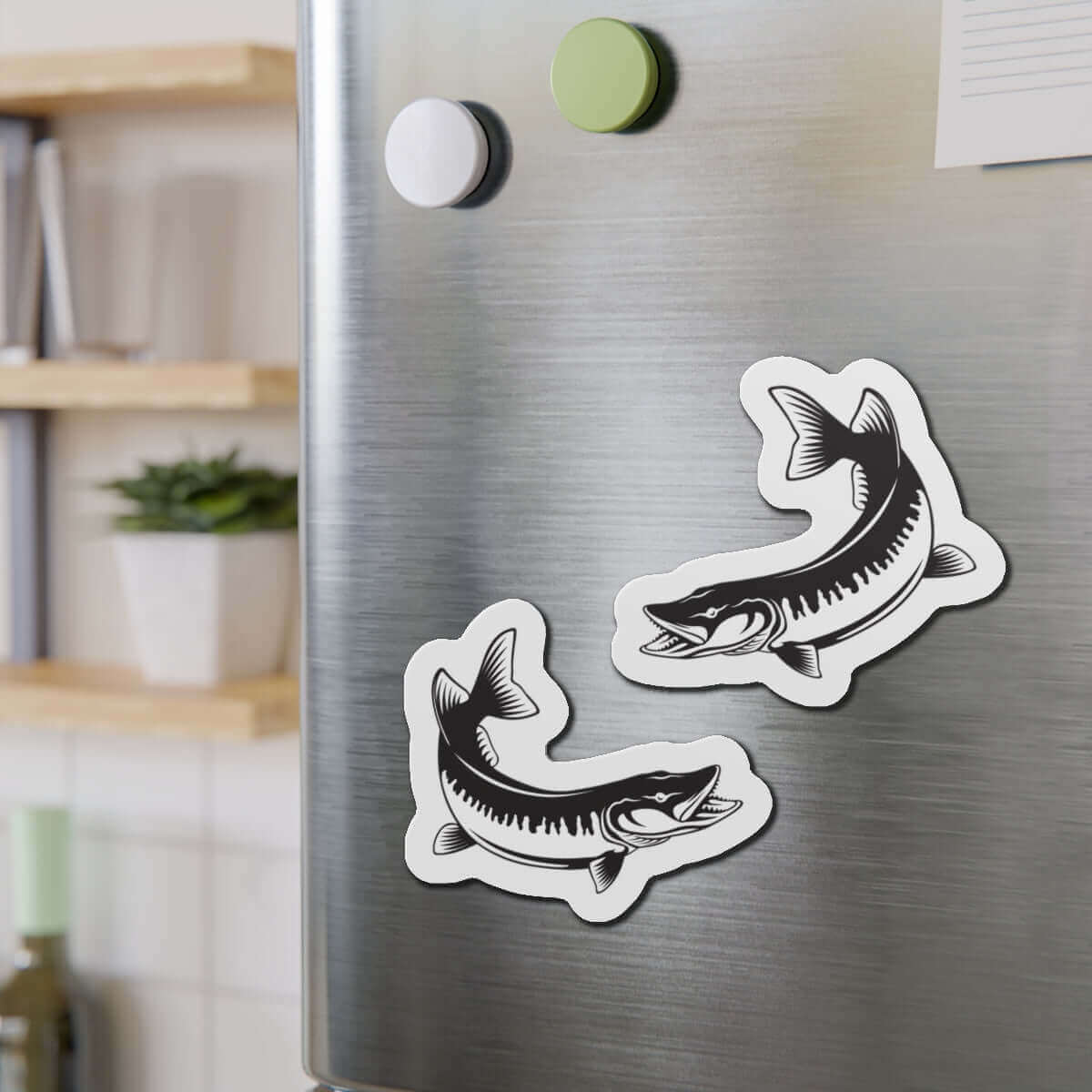 Muskie fish shaped magnets on refrigerator, perfect for fun kitchen décor and fishing enthusiasts.