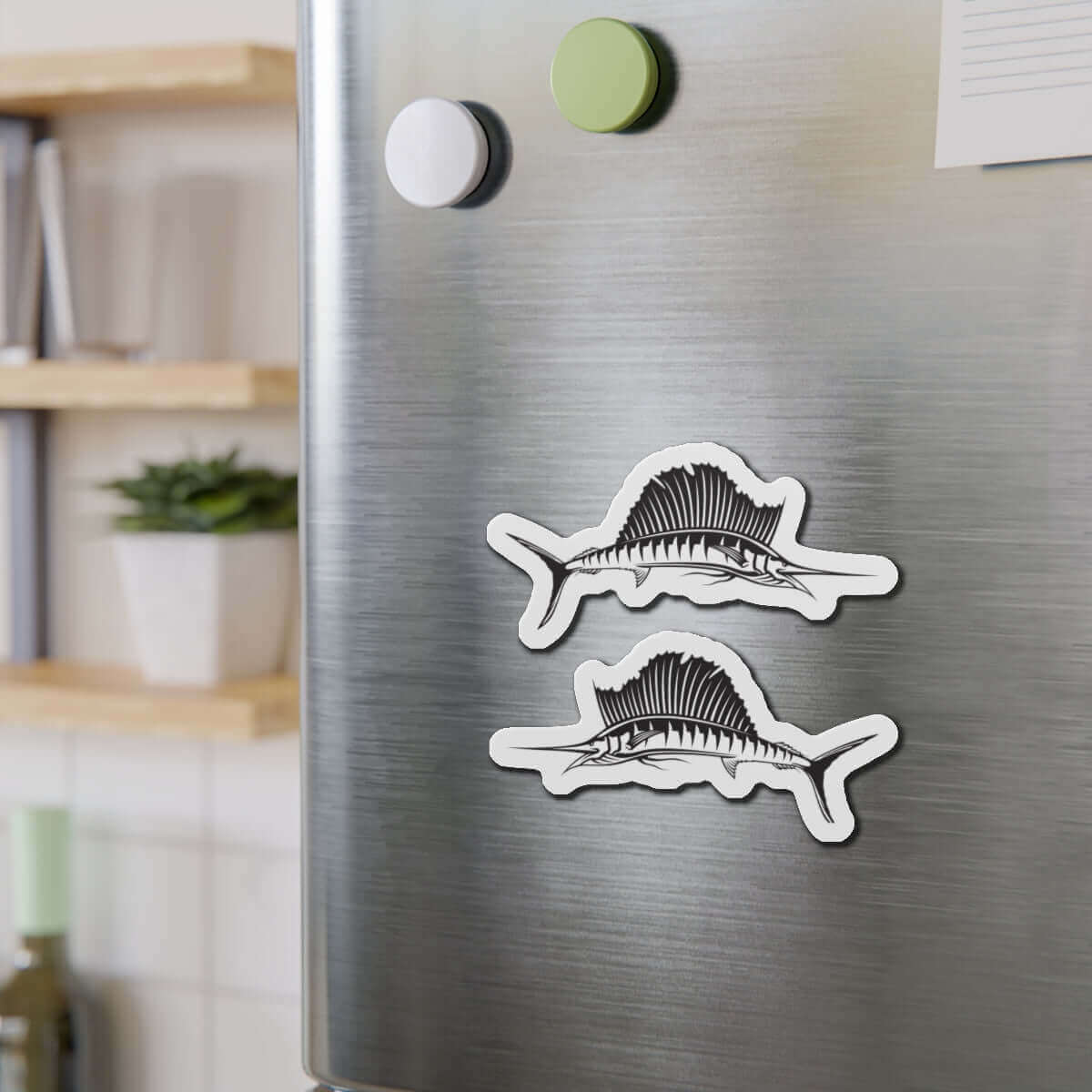 Sailfish shaped magnets on a fridge, adding fish décor and natural flair to the kitchen, perfect for fishing fans.