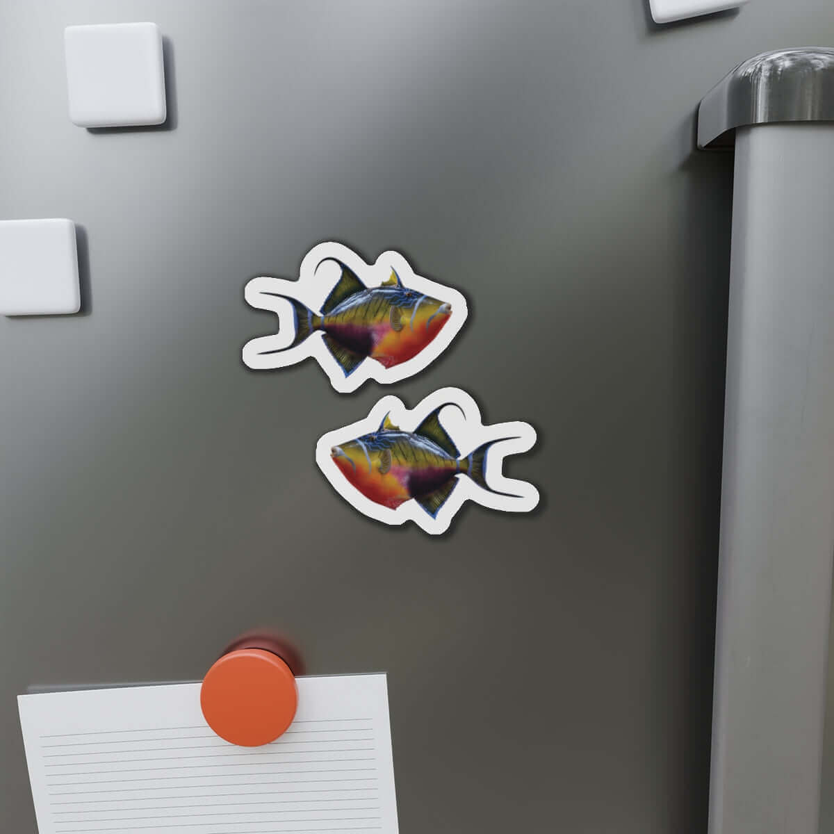 Colorful Triggerfish-shaped magnets on a fridge, perfect for adding fish décor and flair to any kitchen space.