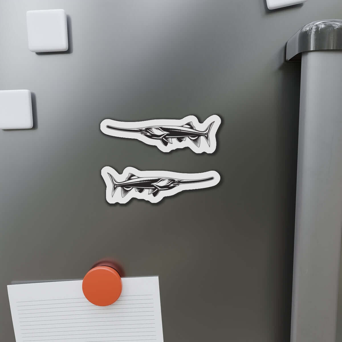 Paddlefish magnets on fridge surface, perfect for fish décor and fun fridge magnets.