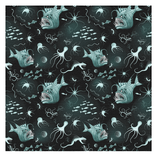 Anglerfish-themed tablecloth with aquatic creatures on a dark background.