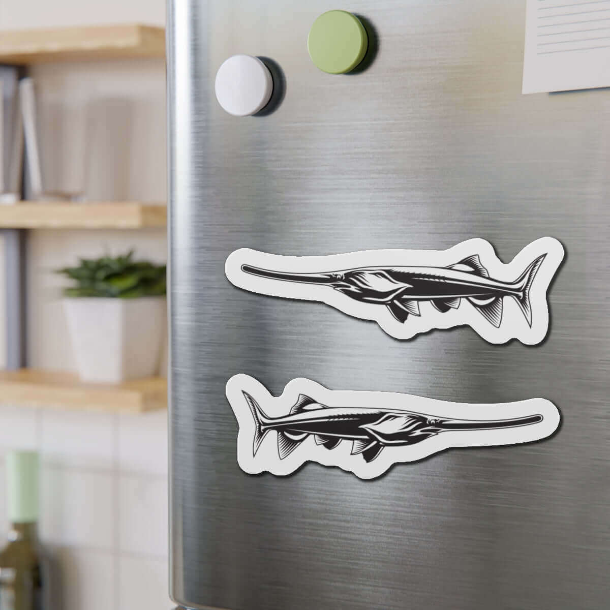 Paddlefish shaped magnets on a fridge, perfect for fish décor and fun kitchen magnets.