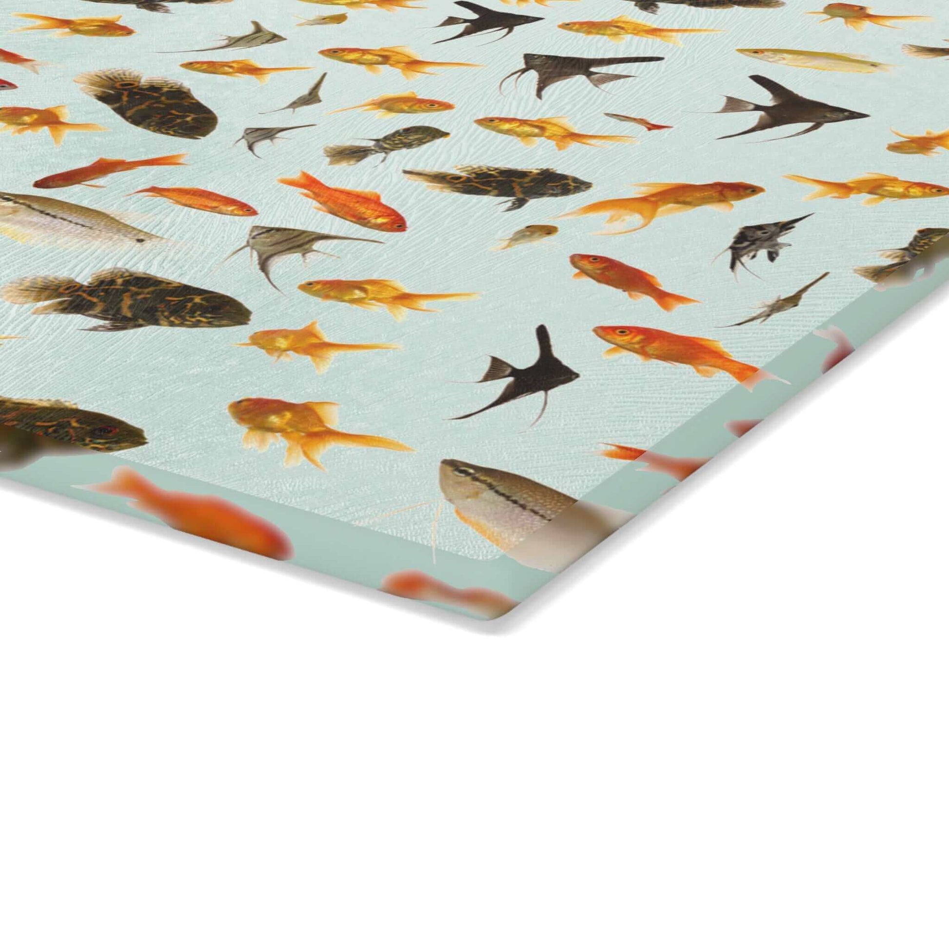 Vibrant fish design on durable tempered glass cutting board for kitchen decor.