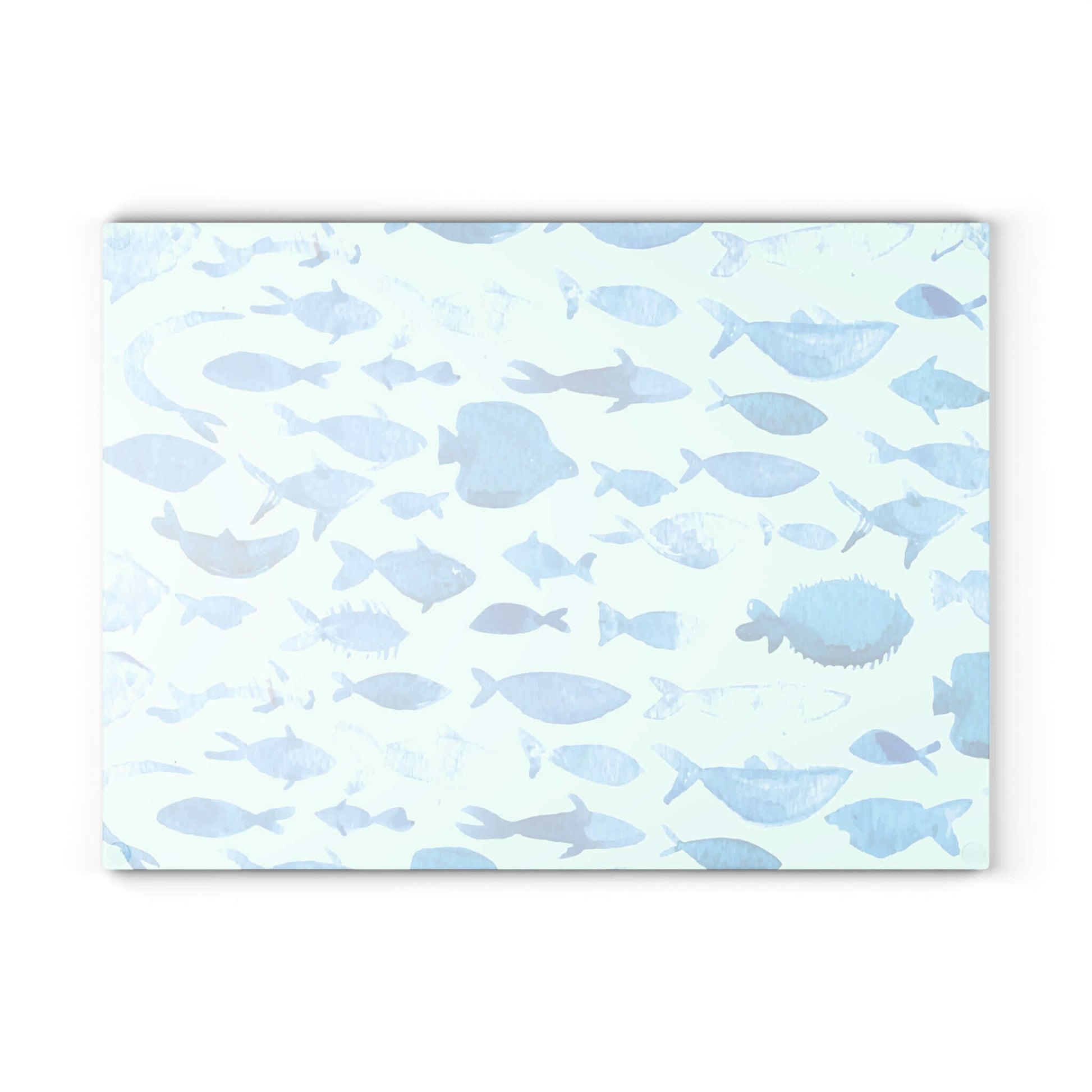 Blue watercolor fish design on a glass cutting board, perfect for kitchen decor and food prep