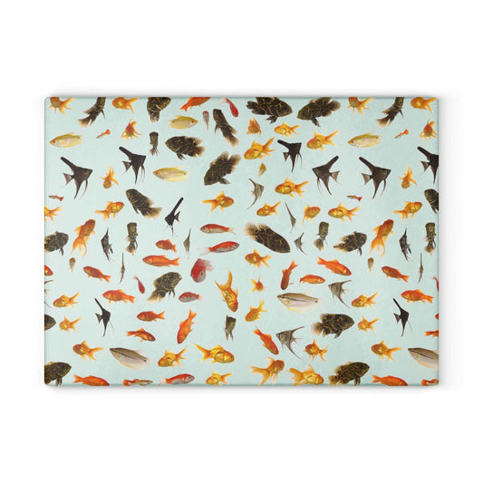 Vibrant aquarium fish design on a durable glass cutting board, perfect for kitchen decor or food prep.