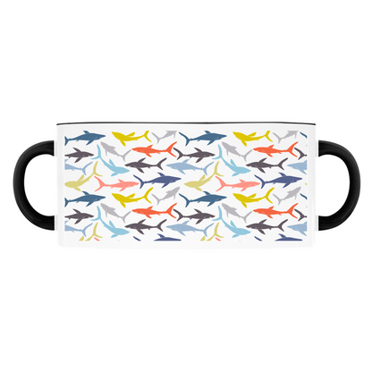 Colorful Reef Sharks Pattern mug on a light blue background, with a red handle and rim.