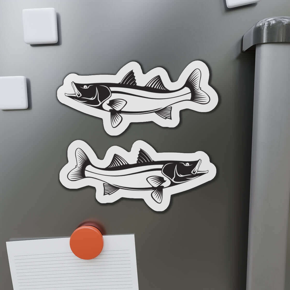 Snook fish shaped magnets on a refrigerator, perfect for fishing fans and fish décor enthusiasts.