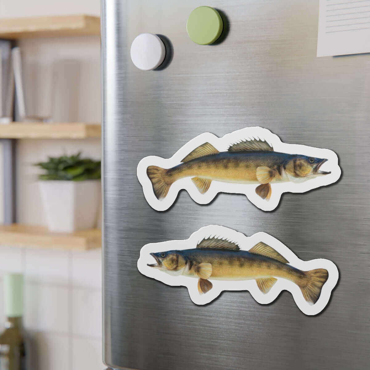 Walleye fish shaped magnets on a fridge, perfect for fun kitchen décor and fishing fans.