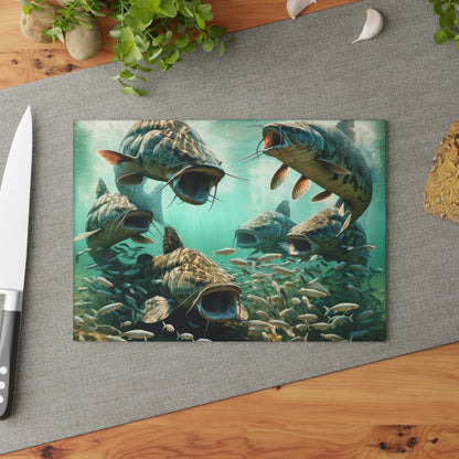 Colorful catfish glass cutting board on kitchen counter with knife and herbs