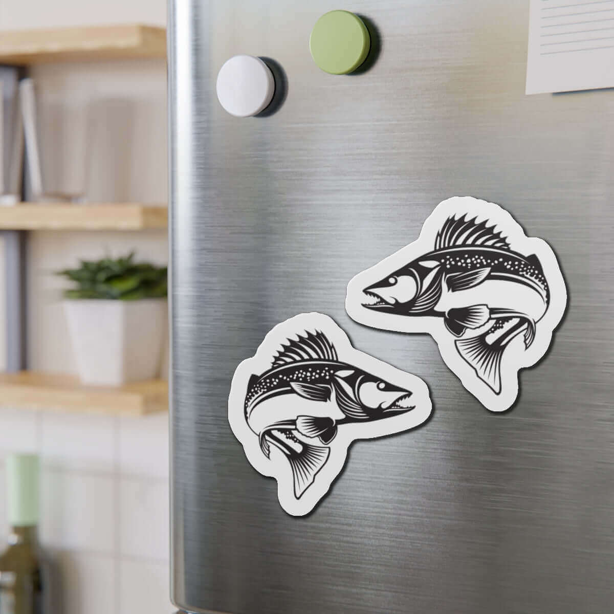 Walleye fish shaped magnets on a fridge, perfect for fish décor and fishing enthusiasts.