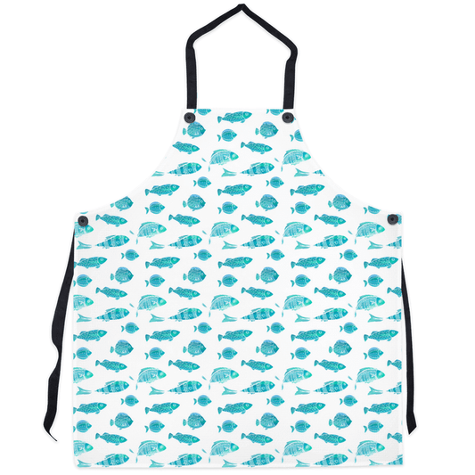 Blue-green fish pattern apron with black straps, perfect for adding a touch of coastal charm to your kitchen. Stylish and practical cooking accessory.