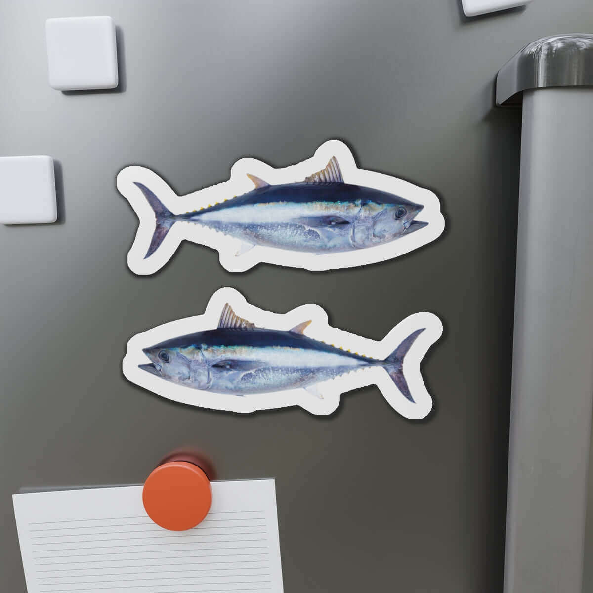 Bluefin Tuna fish shaped magnets on a refrigerator, perfect for fish décor and fishing fans.