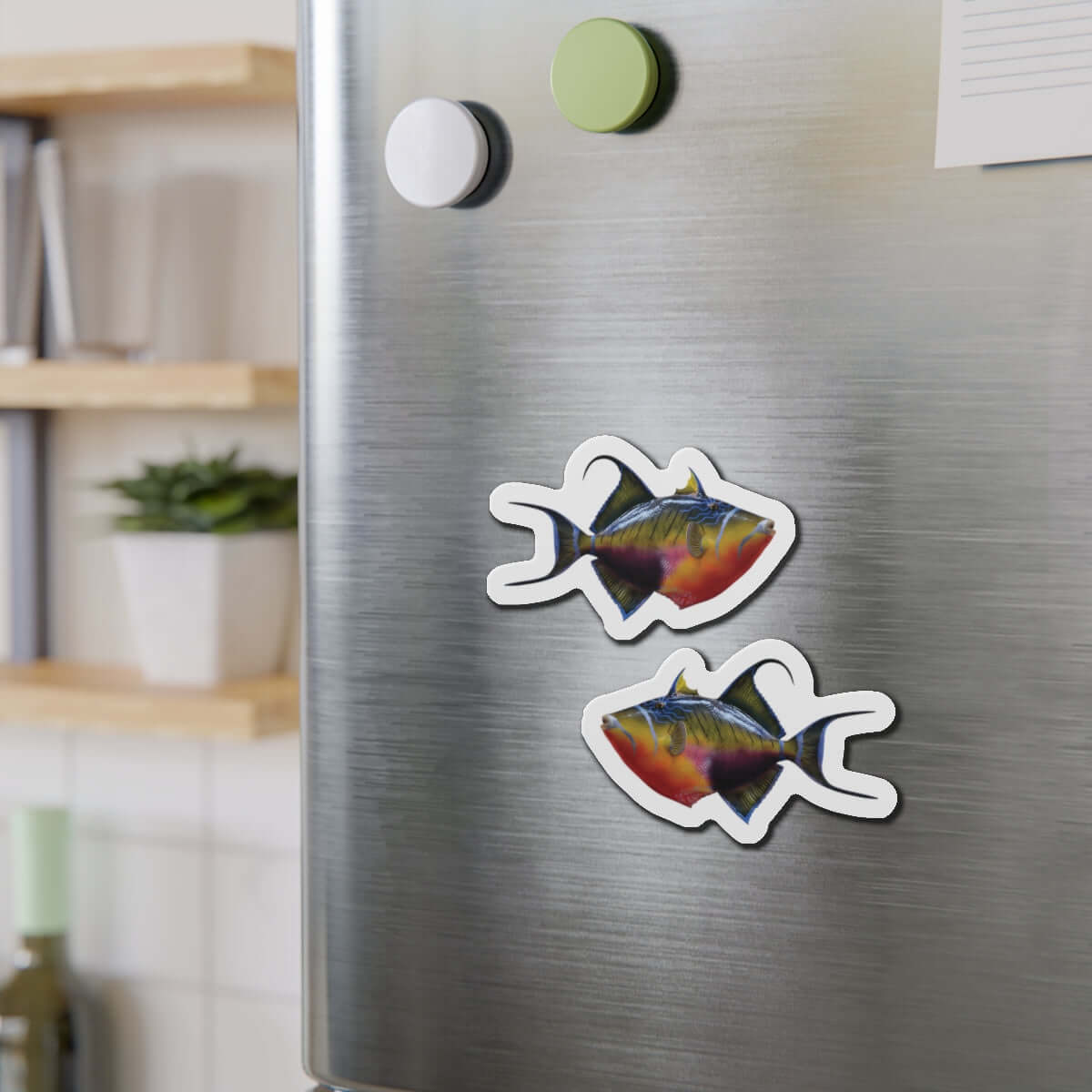 Colorful Triggerfish magnets on a fridge, perfect for fish décor and fun kitchen magnets.