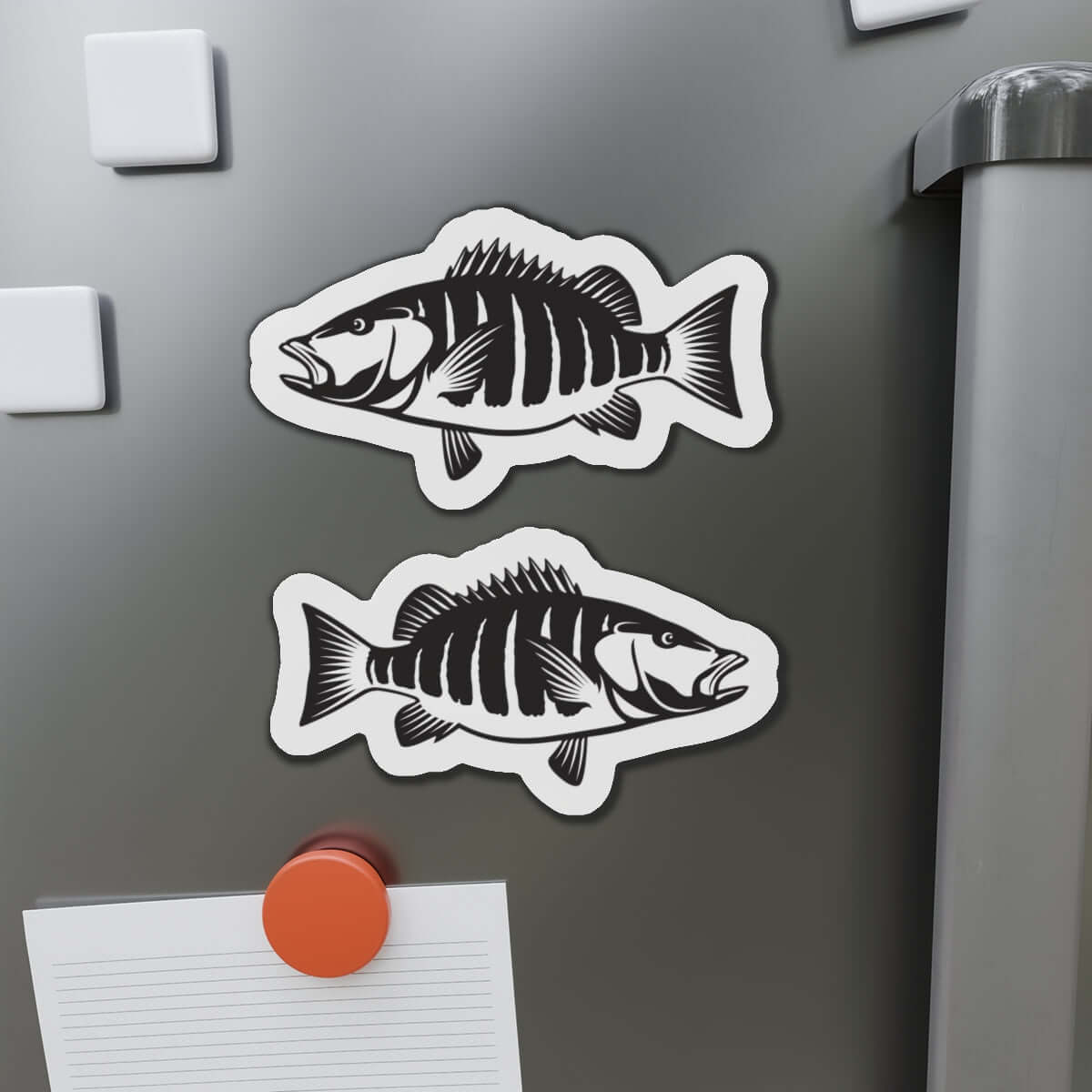 Snapper fish-shaped magnets on fridge, perfect for fish décor and fun kitchen magnet enthusiasts.