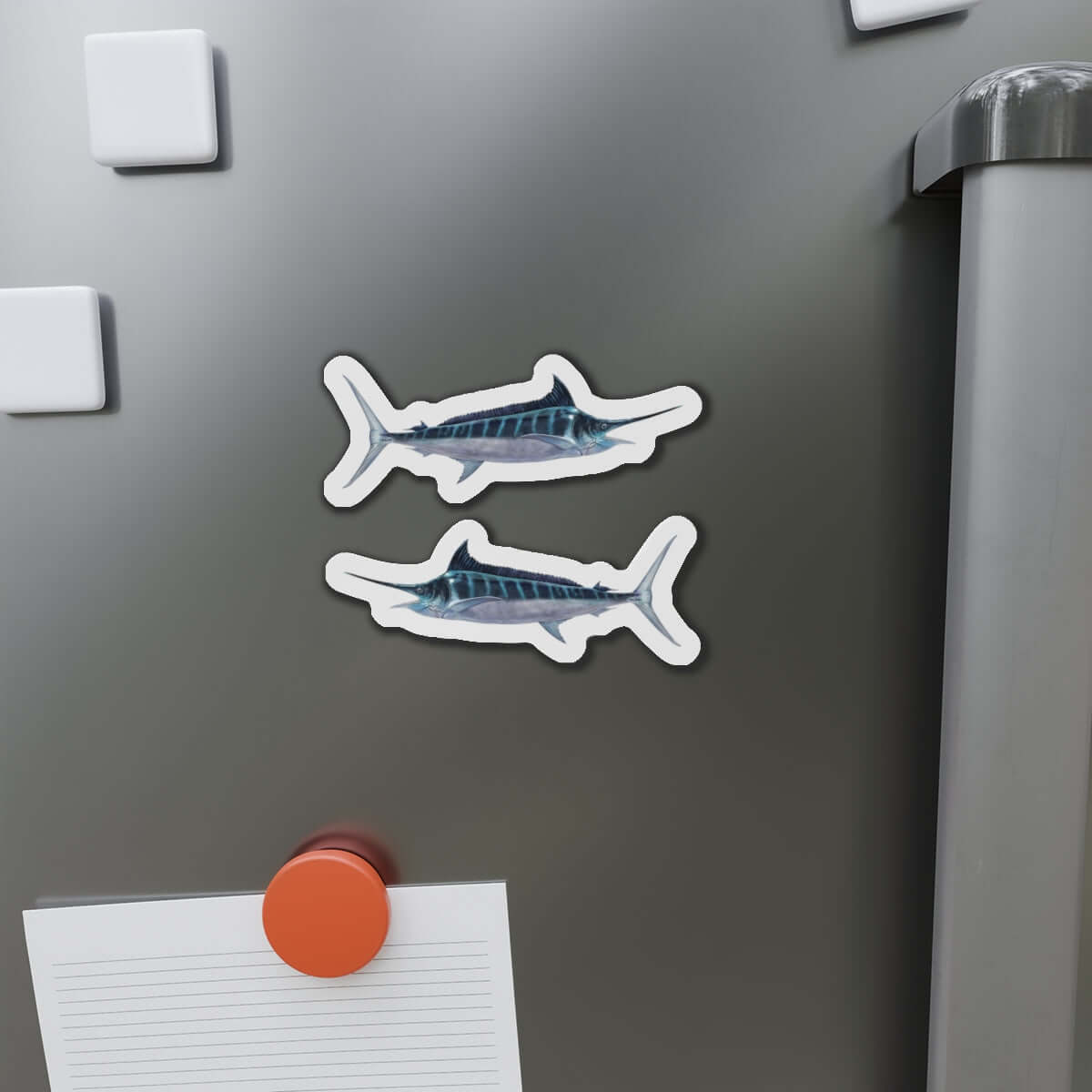 Striped Marlin fish shaped magnets on fridge surface, ideal for fishing enthusiasts and fun kitchen décor.