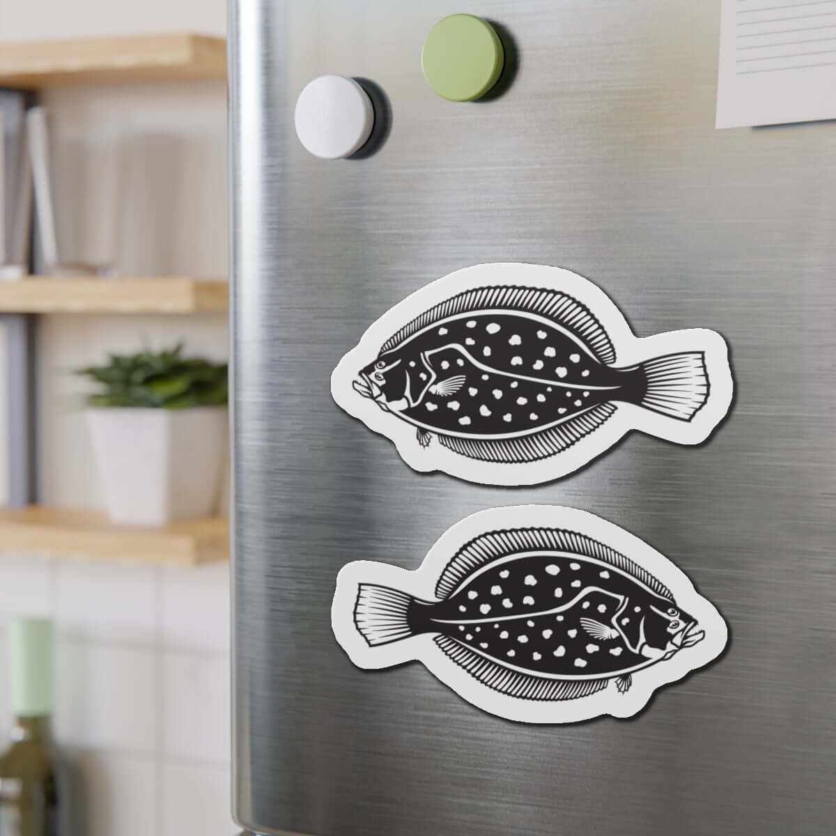 Winter Flounder fish shaped magnets on refrigerator adding fun fish décor to kitchen.