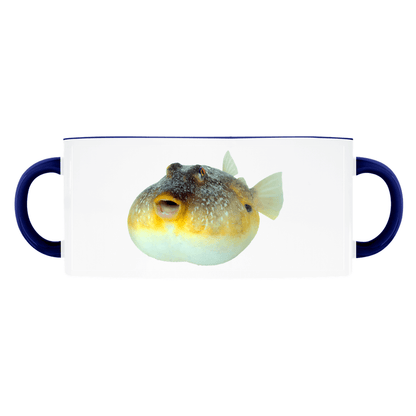 White mug with a puffer fish design, featuring double navy handles on each side.