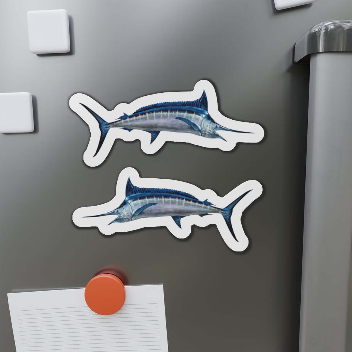 Blue Marlin fish shaped magnets on fridge, adding fun fish décor to a kitchen setting.