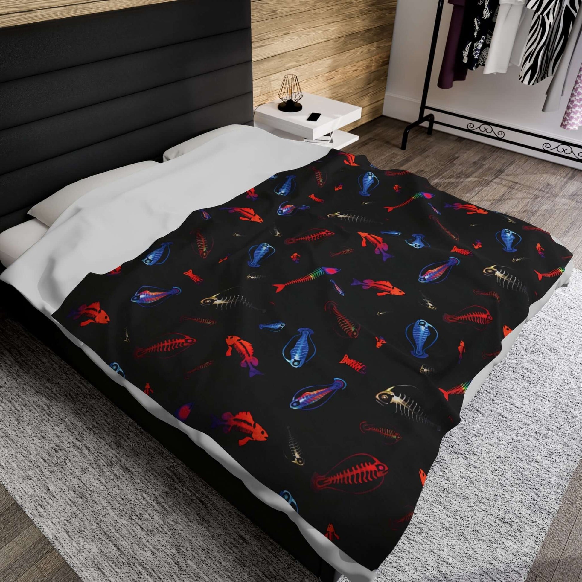 Cozy Glowing Skeleton Fish plush blanket on a bed, featuring vibrant deep-sea skeleton designs that add a mysterious underwater touch.