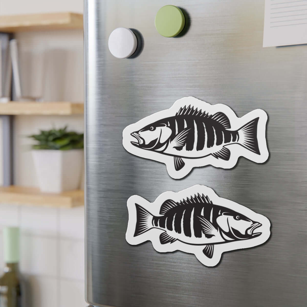 Snapper fish shaped magnets on a fridge, perfect for fish décor and fun kitchen magnets enthusiasts.