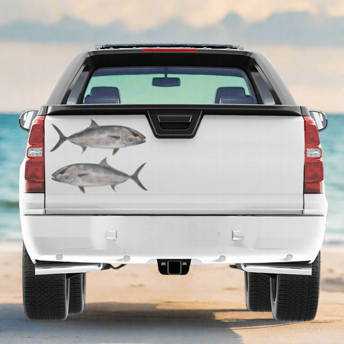 Large Amberjack decals on a truck, parked at a beach.