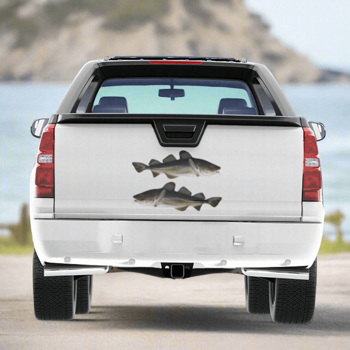 Atlantic Cod decals on a truck near the ocean.