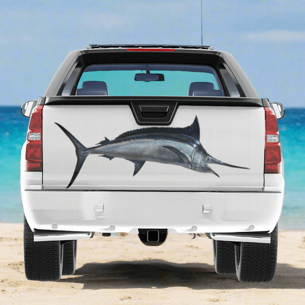 Large Black Marlin decal on a pickup truck near a blue ocean.