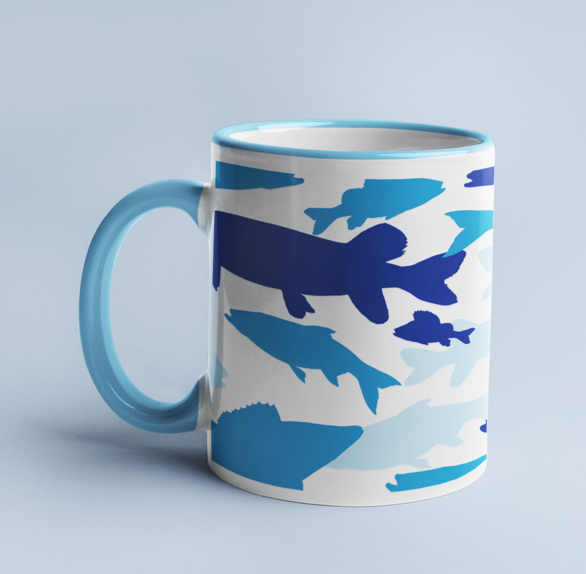 Fish Blue Camo mug on a light blue background, with a light blue handle and rim. 