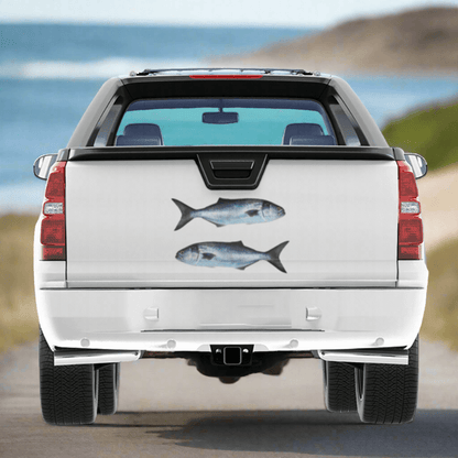 Large Bluefish decals on a truck near the ocean.