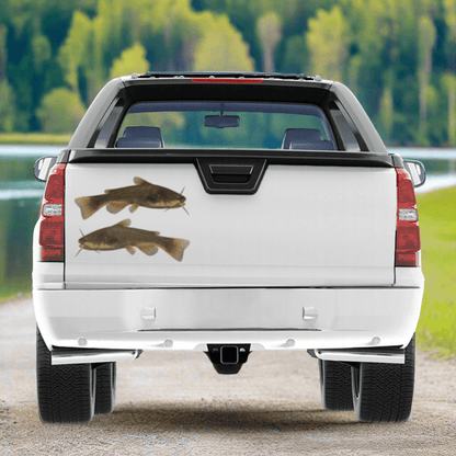 Large Bullhead Catfish decals on a pickup truck near a river.