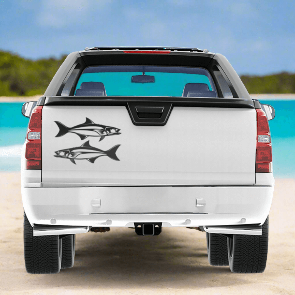 Large Cobia decals on a white pickup truck near the ocean.