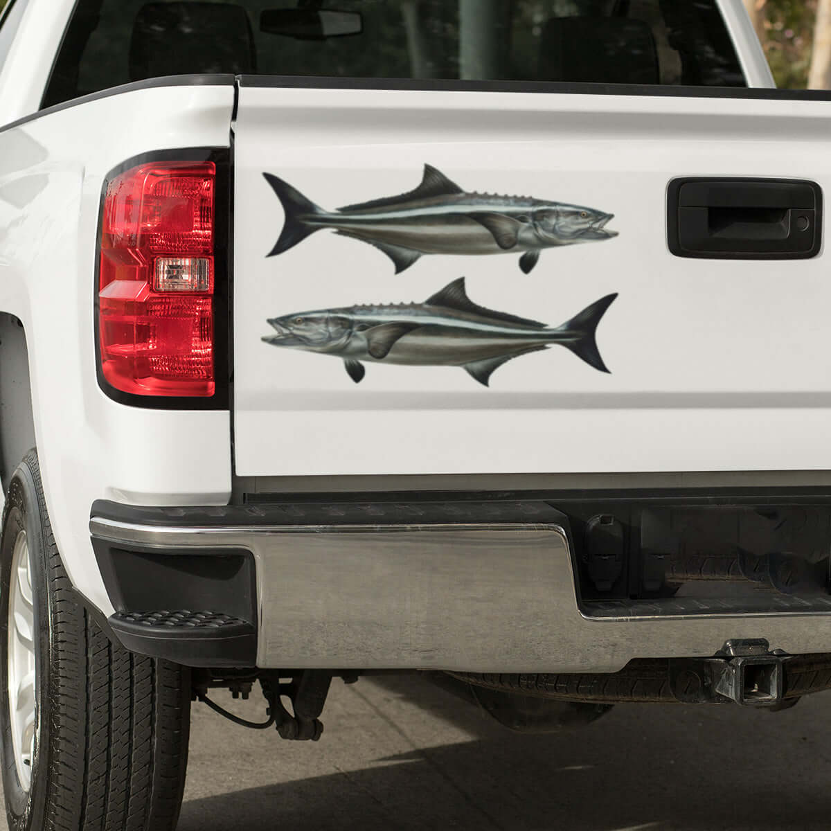 Large Cobia decals on a white pickup truck.