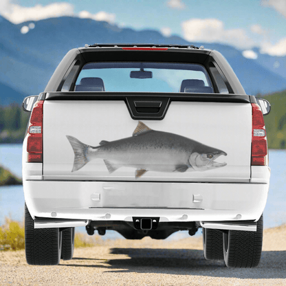 Coho Salmon large decals on a pickup truck near a large river.