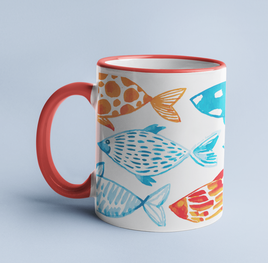 Watercolor Fish mug on a light blue background, with a light blue handle and rim.