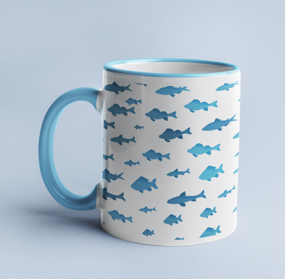 Fish and Shark mug on a light blue background, with a light blue handle and rim.