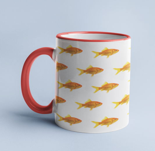 Goldfish mug on a light blue background, with a red handle and rim.